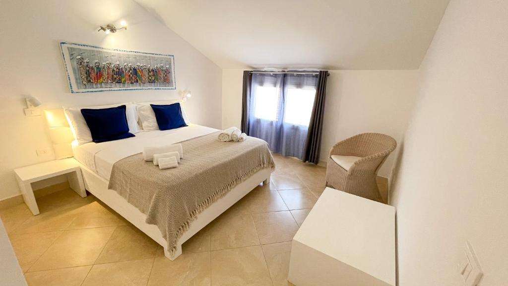 Postel nebo postele na pokoji v ubytování Branco Suites - Rooms & Holiday Apartments