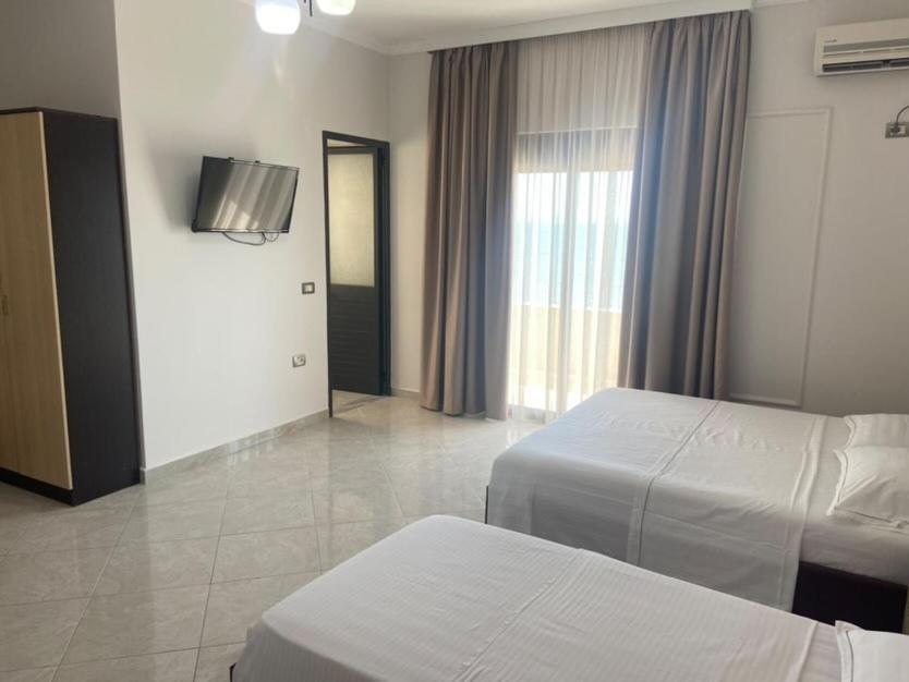 Voodi või voodid majutusasutuse Hotel Tirona toas