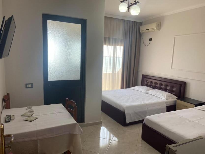 Voodi või voodid majutusasutuse Hotel Tirona toas