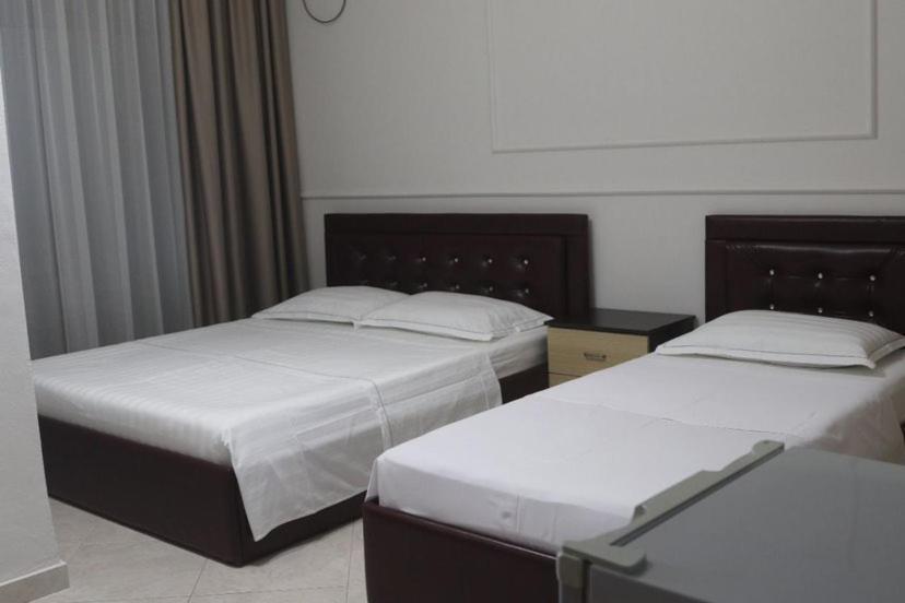 Voodi või voodid majutusasutuse Hotel Tirona toas