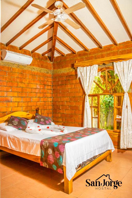 Postel nebo postele na pokoji v ubytování Hostal San Jorge