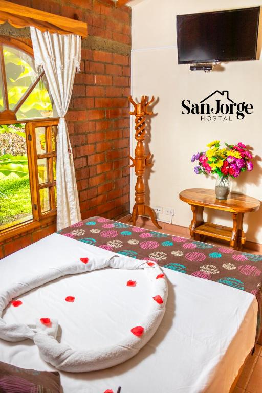 Postel nebo postele na pokoji v ubytování Hostal San Jorge