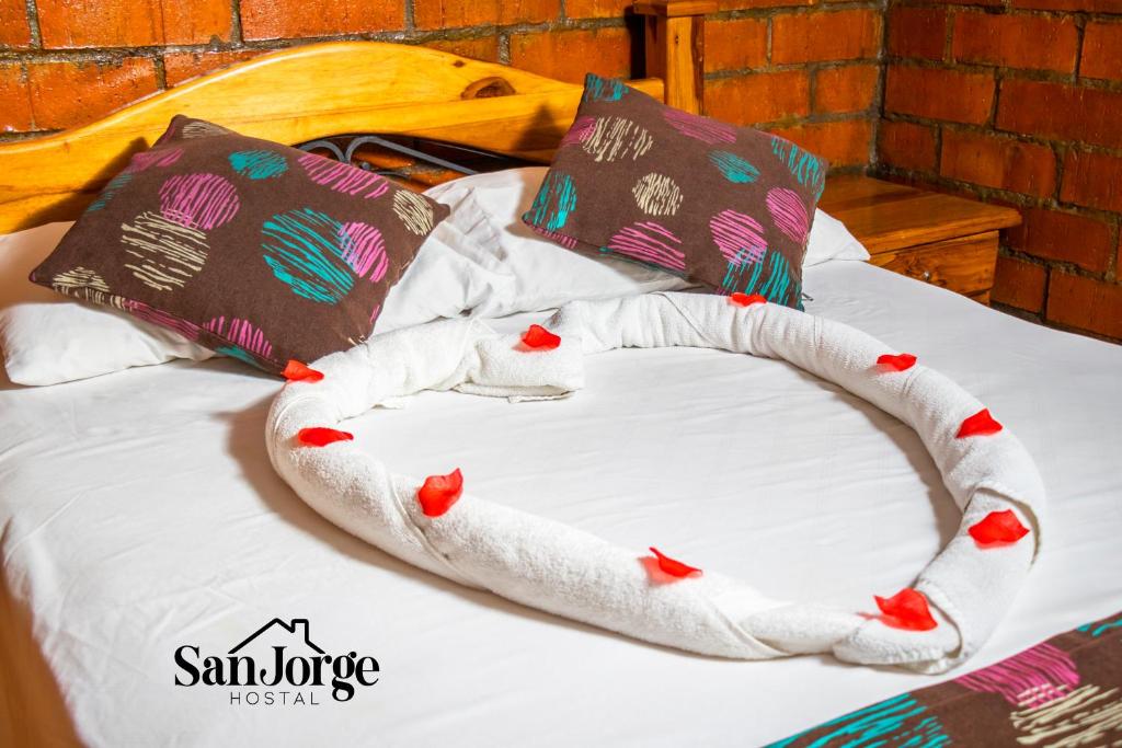 Postel nebo postele na pokoji v ubytování Hostal San Jorge
