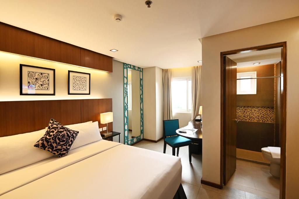 Postel nebo postele na pokoji v ubytování St Mark Hotel