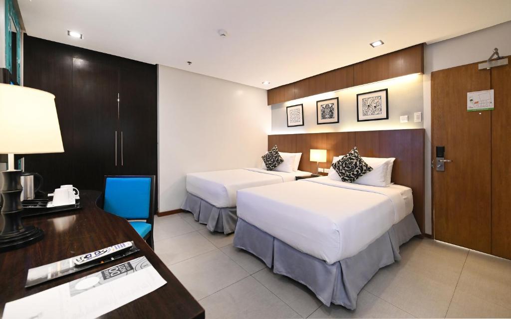 Postel nebo postele na pokoji v ubytování St Mark Hotel