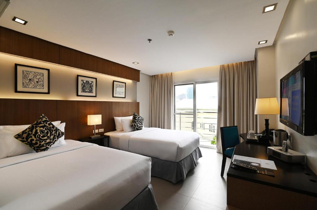 Postel nebo postele na pokoji v ubytování St Mark Hotel
