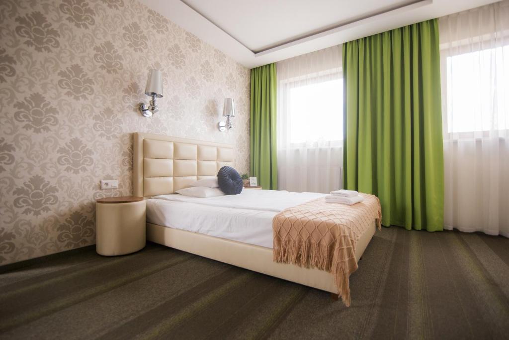 Hotel Wróblewscy tesisinde bir odada yatak veya yataklar