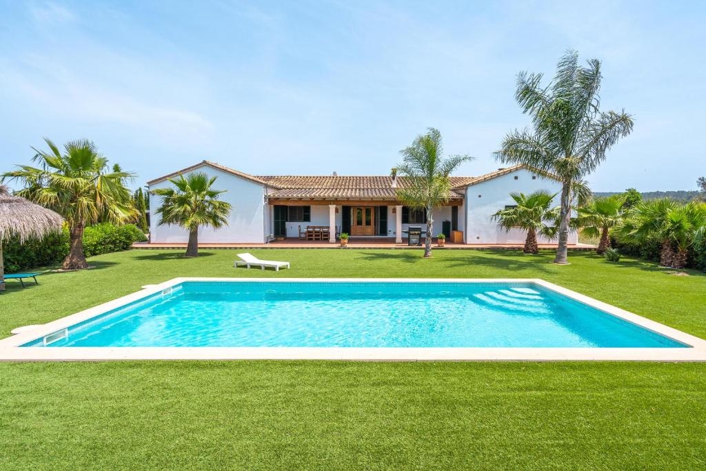 an image of a swimming pool in front of a house at Can Mossenyer in Santa Maria del Camí