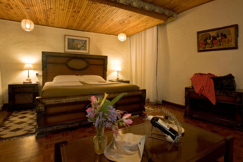 Postel nebo postele na pokoji v ubytování Masai Mara Sopa Lodge