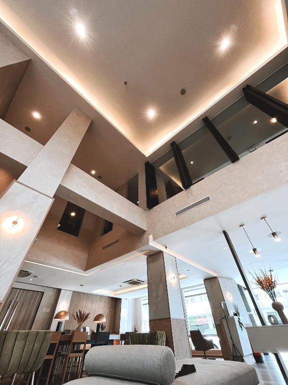 a lobby of a building with a large ceiling at The Brunei Hotel in Bandar Seri Begawan