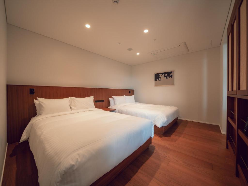 Postel nebo postele na pokoji v ubytování Hotel Vison