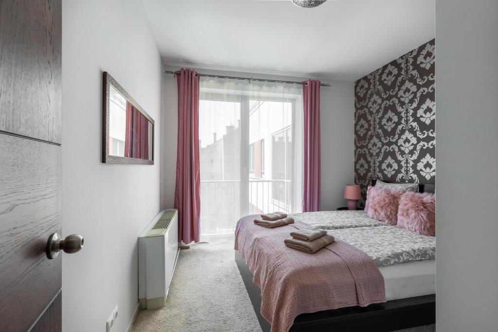 Postel nebo postele na pokoji v ubytování Budapest Holidays Apartments & Spa