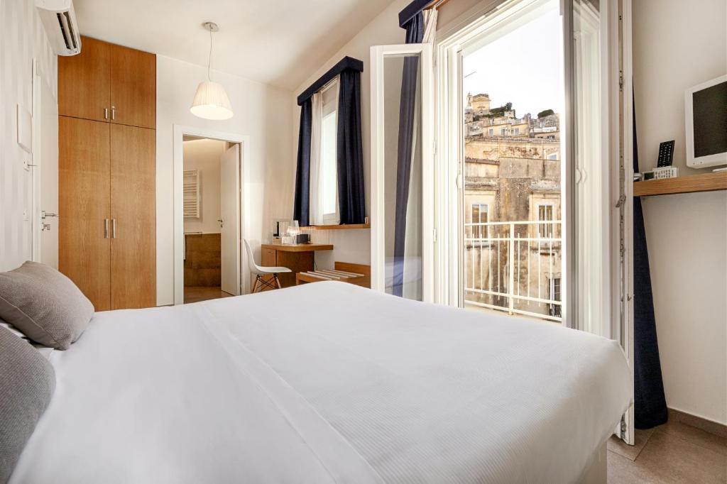 Postel nebo postele na pokoji v ubytování Iblaresort Boutique Hotel
