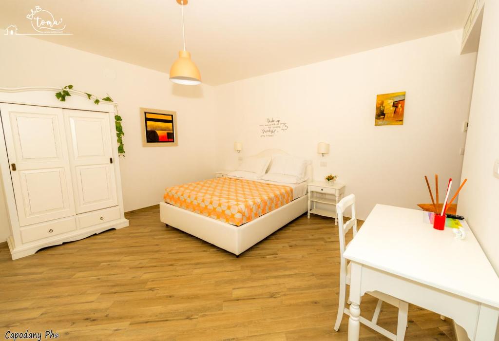 Postel nebo postele na pokoji v ubytování B&B Toma'