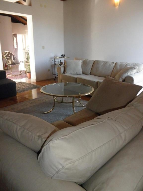 a living room with a couch and a coffee table at Apartment Preka in Rab
