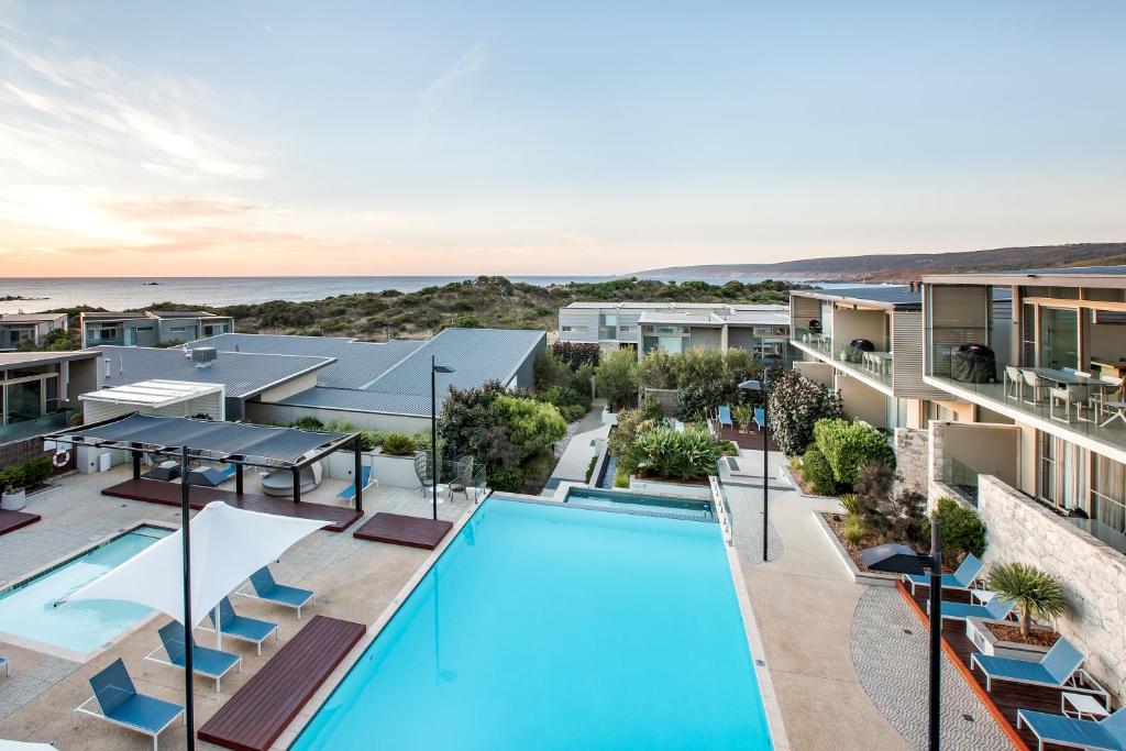 a hotel room with a pool and beach at Smiths Beach Resort in Yallingup