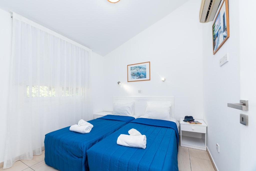 Postel nebo postele na pokoji v ubytování Fig Tree Z Holiday Resort