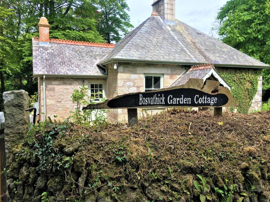 a sign for the presbyterian garden college in front of a house at Bosvathick Garden Cottage in Constantine