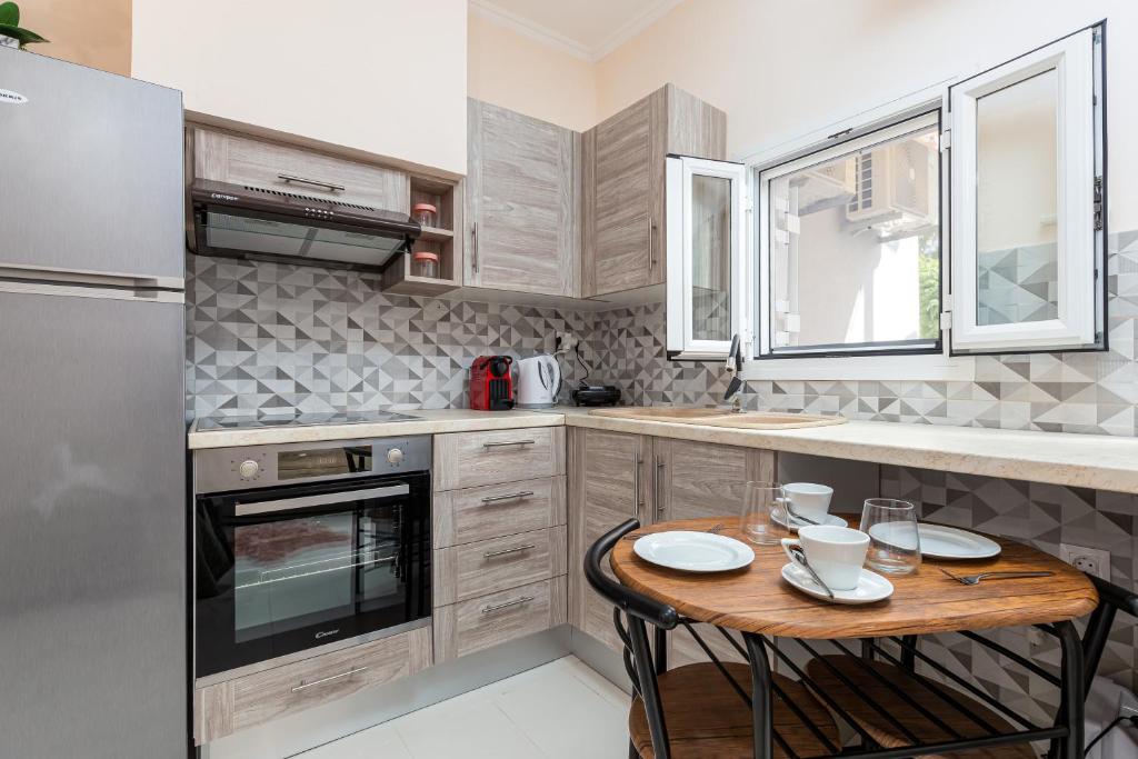Kuchyň nebo kuchyňský kout v ubytování Fouki apartments Ipsos Beach