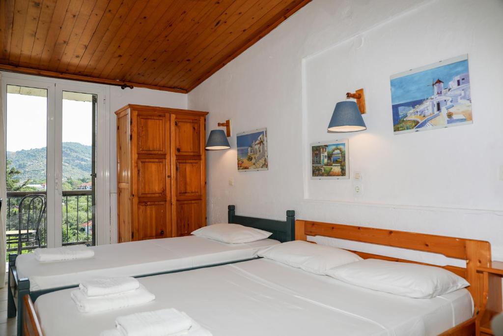 Postel nebo postele na pokoji v ubytování Hotel Aggeliki