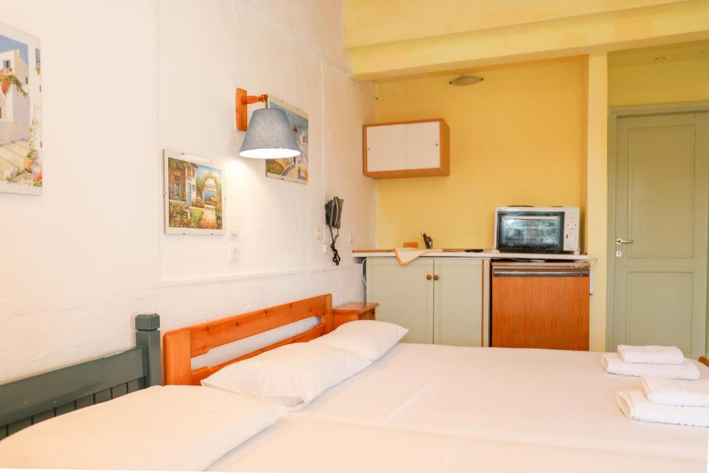 Postel nebo postele na pokoji v ubytování Hotel Aggeliki