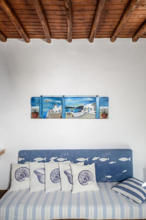 A bed or beds in a room at Naxos Pantheon House Panoramic View