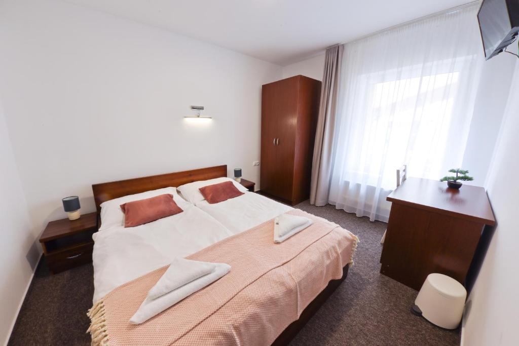 Postel nebo postele na pokoji v ubytování Hotel Slanica
