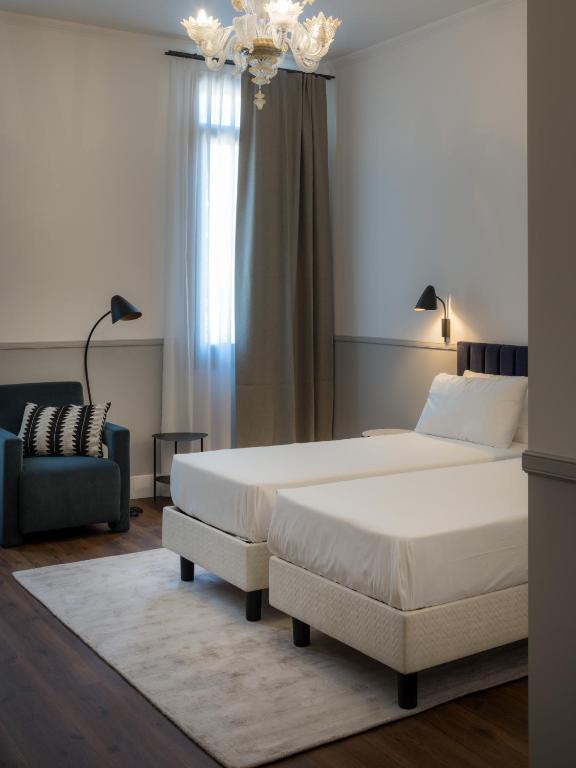 Postel nebo postele na pokoji v ubytování The Foscarini