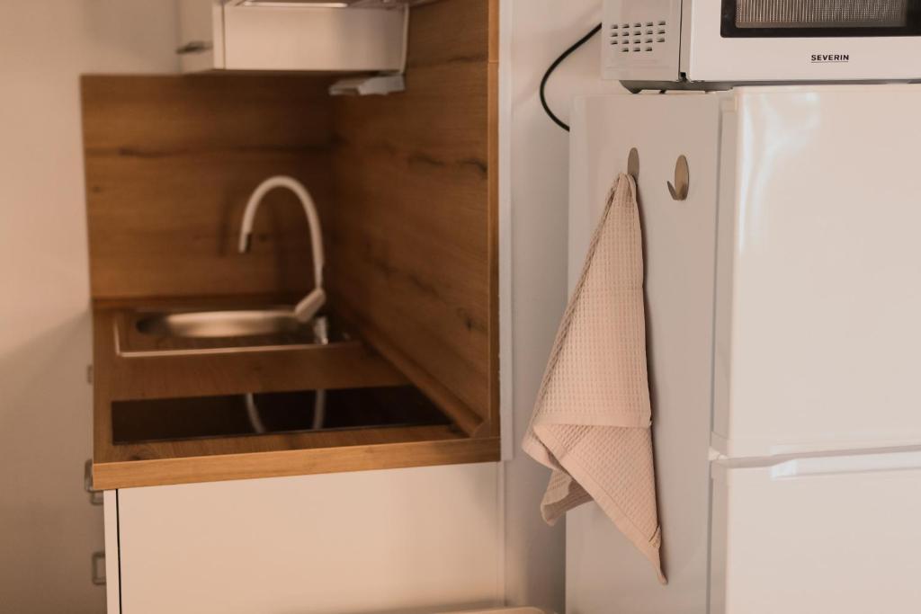 Kuchyňa alebo kuchynka v ubytovaní Apartmani Rafaela