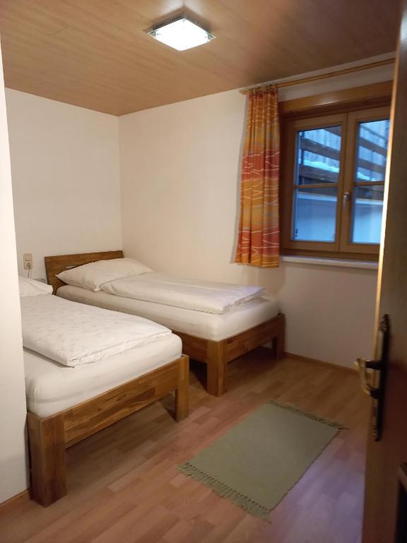 Postel nebo postele na pokoji v ubytování Ferienwohnung Stelzis