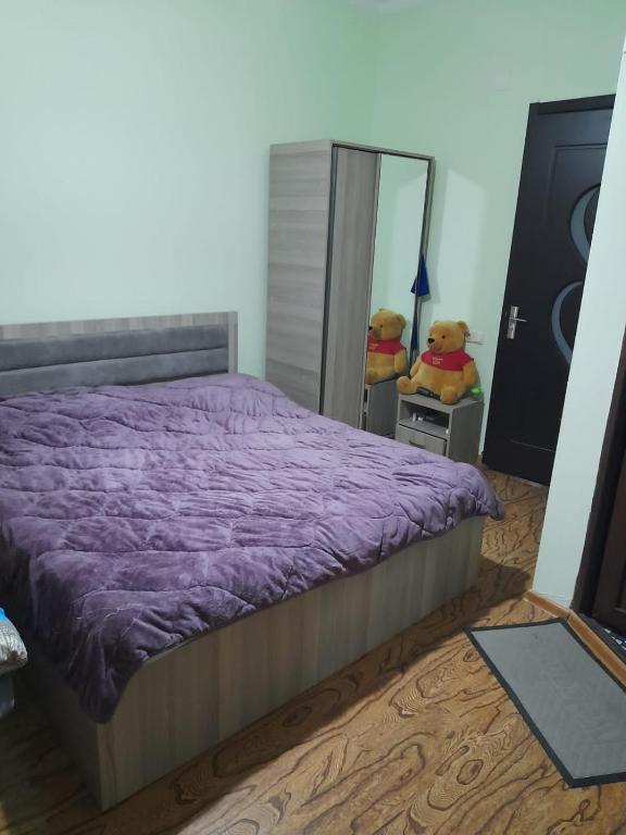 Postel nebo postele na pokoji v ubytování Guest House Kakha