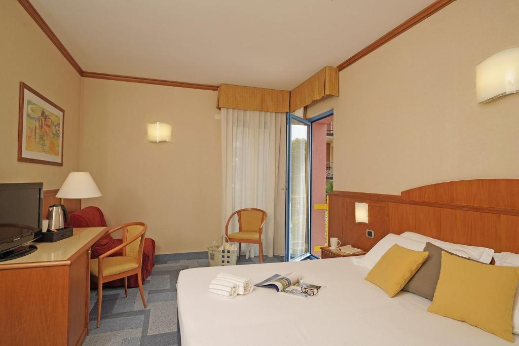 Postel nebo postele na pokoji v ubytování Hotel Sportsman