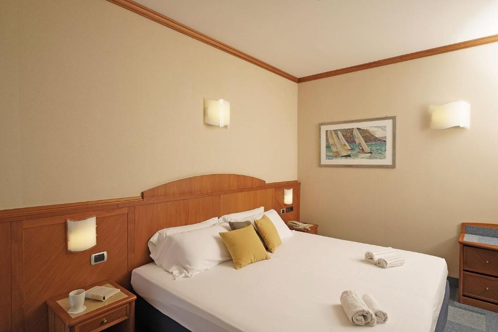 Postel nebo postele na pokoji v ubytování Hotel Sportsman