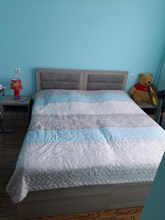 Postel nebo postele na pokoji v ubytování Guest House Kakha