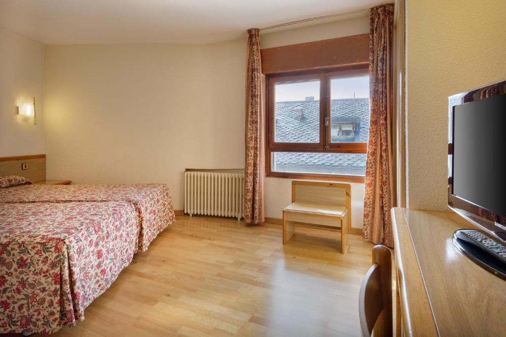 Postel nebo postele na pokoji v ubytování Hotel Nievesol