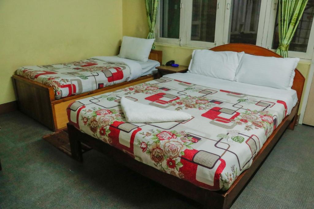 Postel nebo postele na pokoji v ubytování hotel Backpackers inn