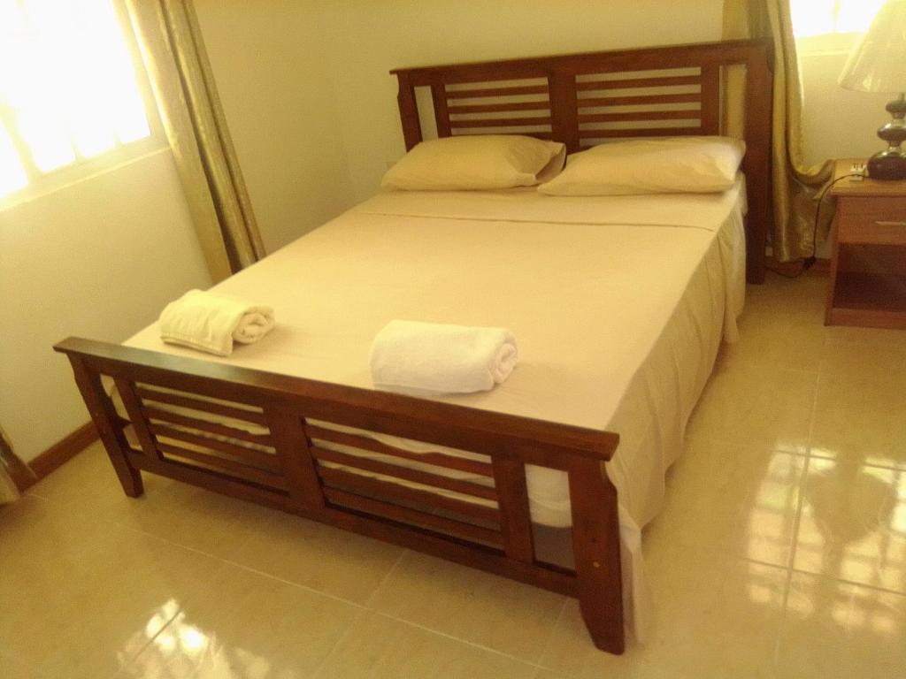 Postel nebo postele na pokoji v ubytování Anse Royale Bay View Apartments
