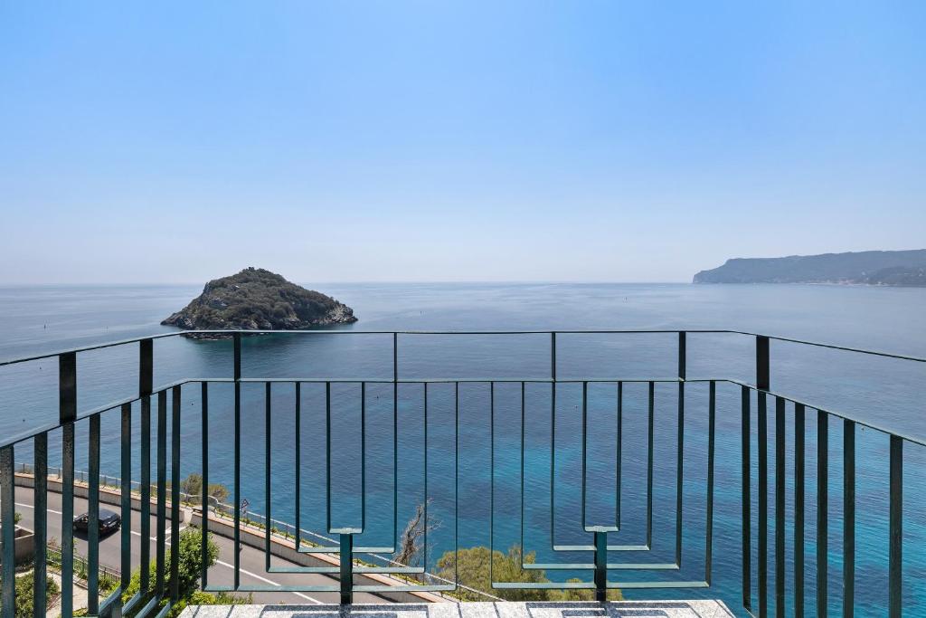 a view of the ocean from a balcony at Appartamento stupenda vista mare in Bergeggi