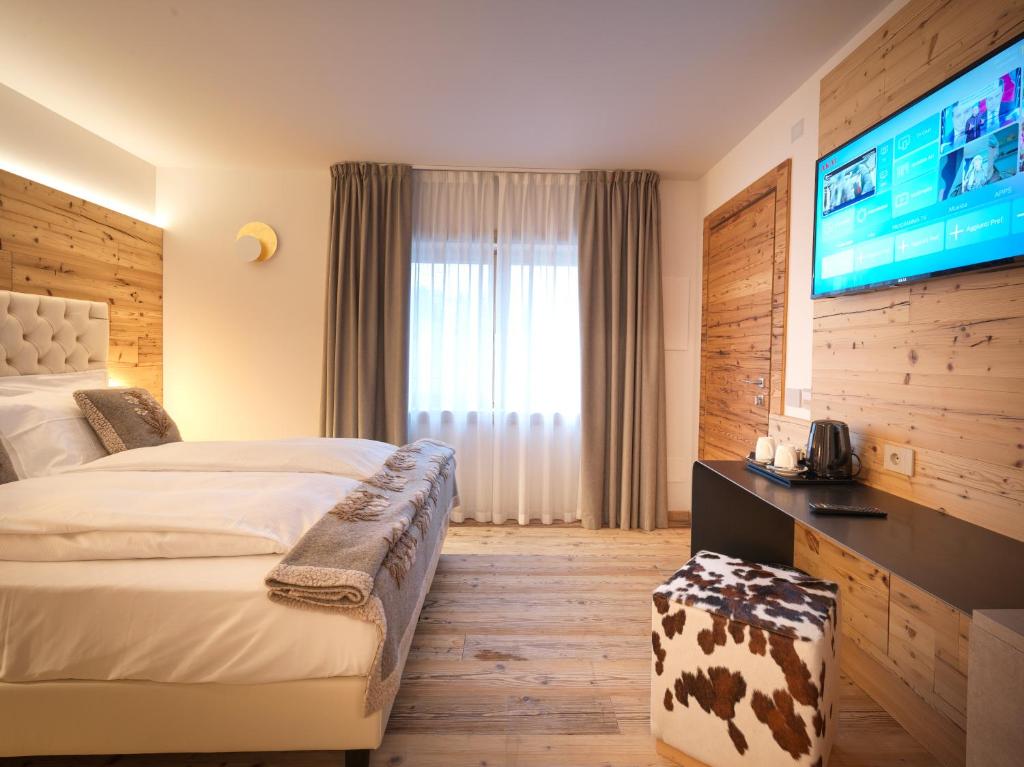 Televízia a/alebo spoločenská miestnosť v ubytovaní RESORT VALFORMICA