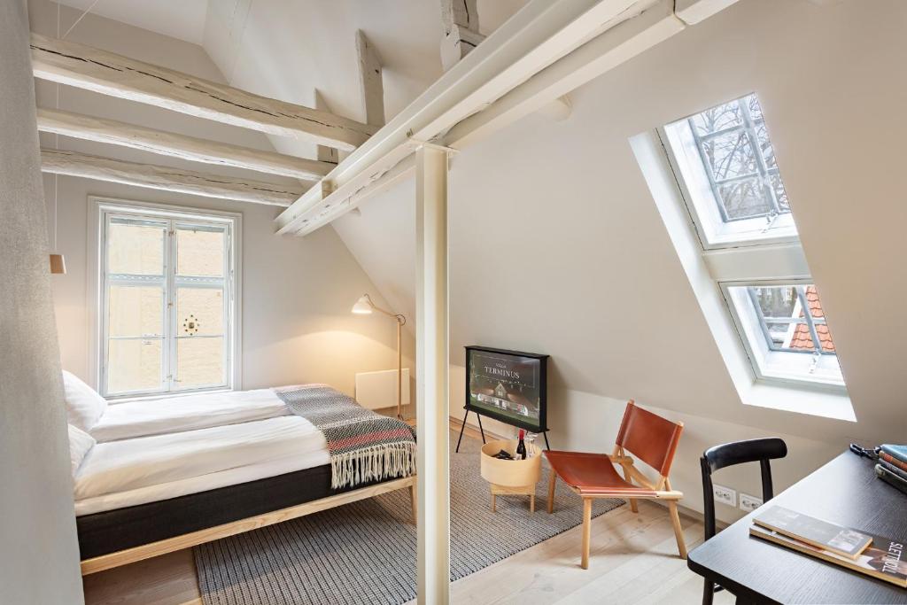 Postel nebo postele na pokoji v ubytování Grand Hotel Terminus
