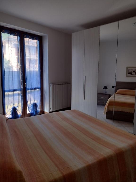 Posteľ alebo postele v izbe v ubytovaní Casa Tiziana