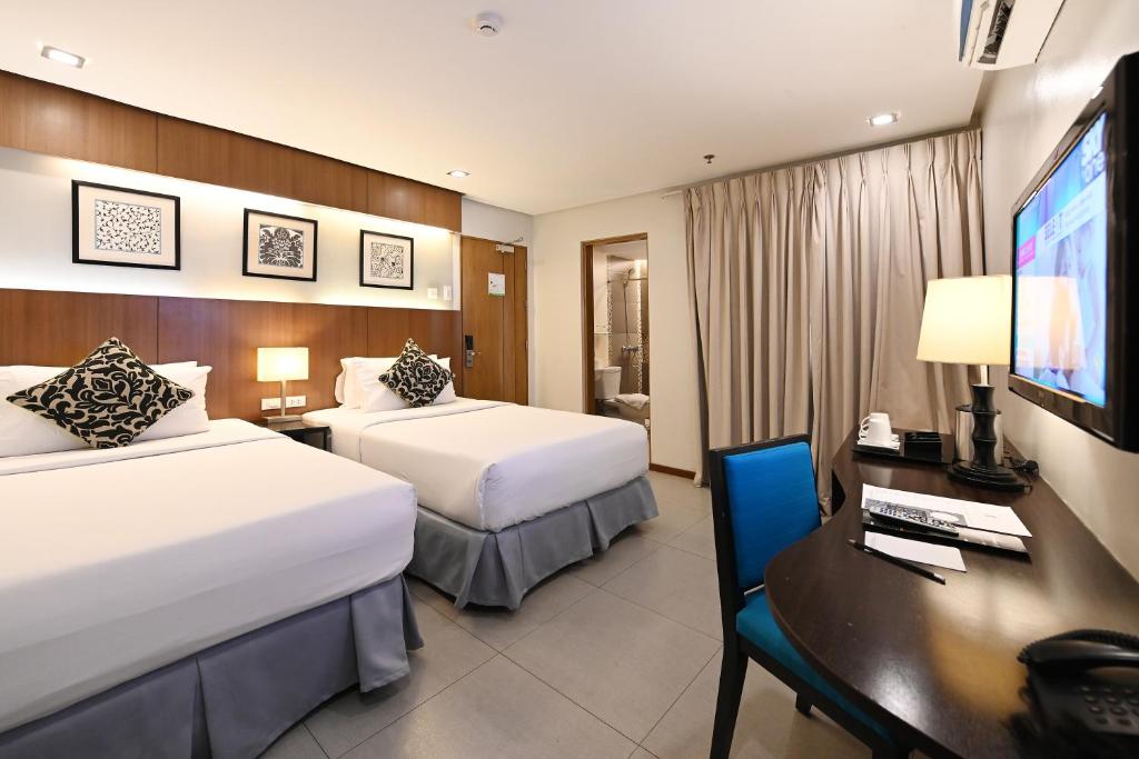 Postel nebo postele na pokoji v ubytování St Mark Hotel