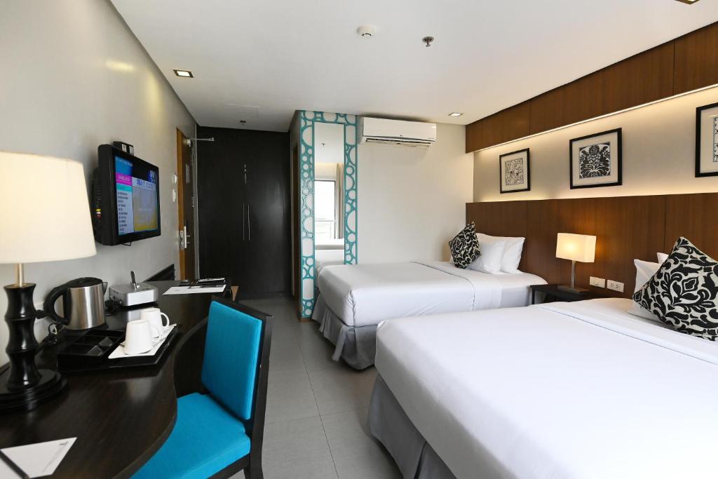 Postel nebo postele na pokoji v ubytování St Mark Hotel
