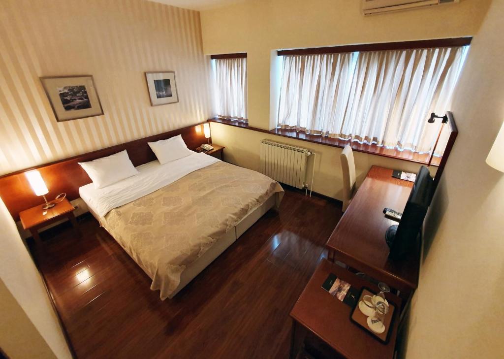 Postel nebo postele na pokoji v ubytování Hotel Centar