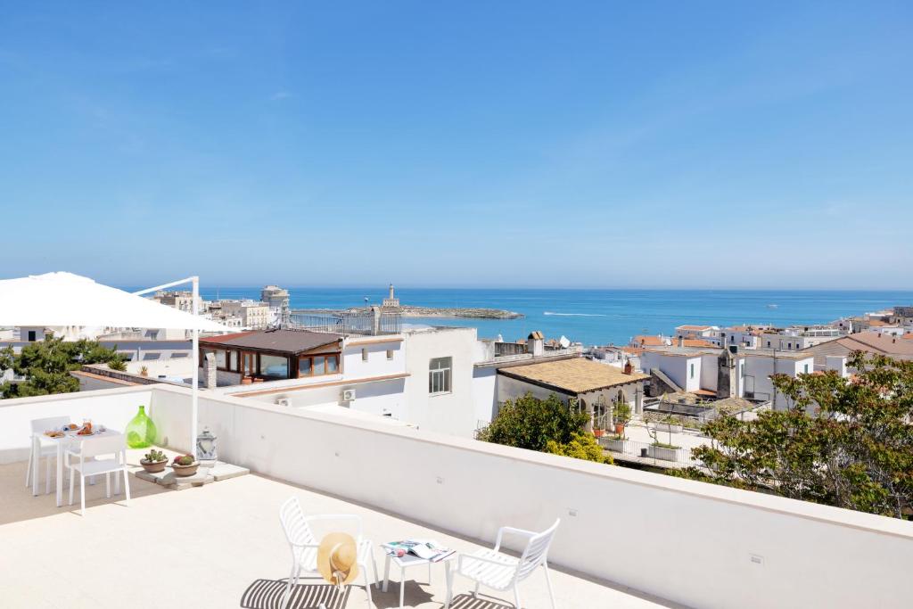 a view of the ocean from the balcony of a house at B&B La Rosa dei Venti, panoramico nel cuore di Vieste Vista mare Centro storico in Vieste