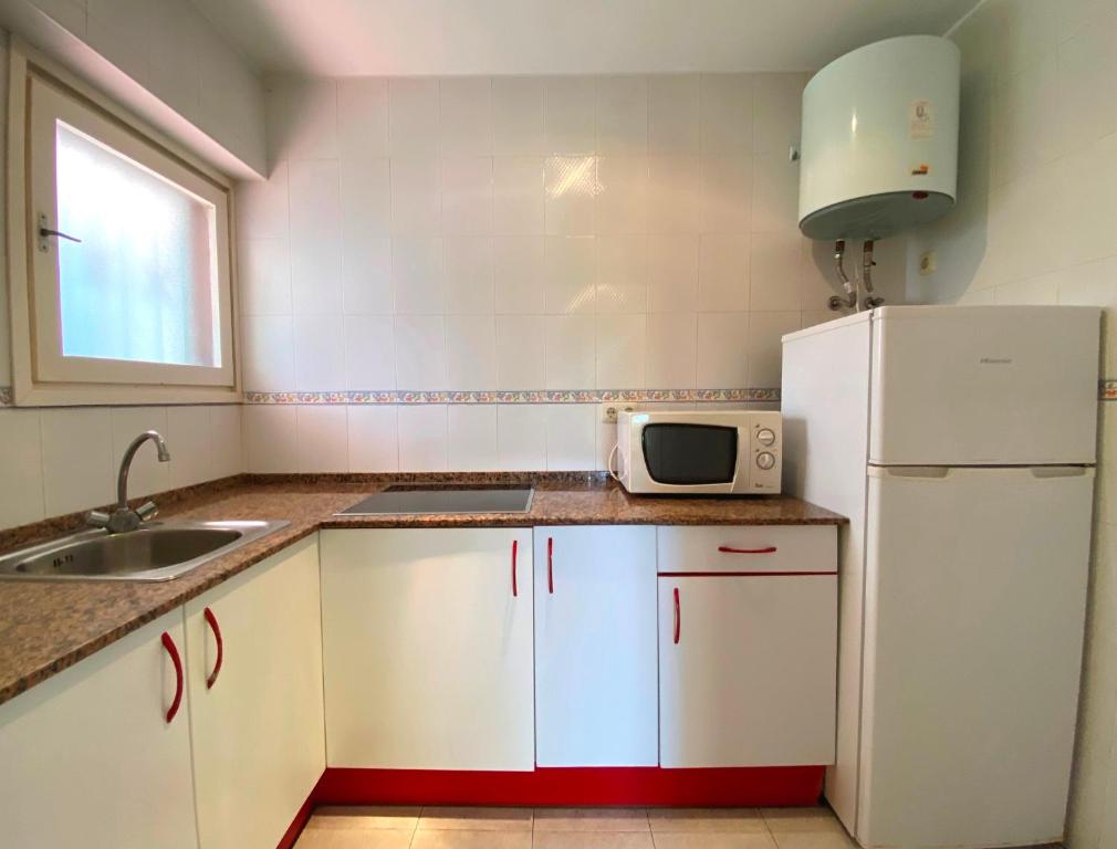 Kuchyň nebo kuchyňský kout v ubytování Apartamentos Flandria