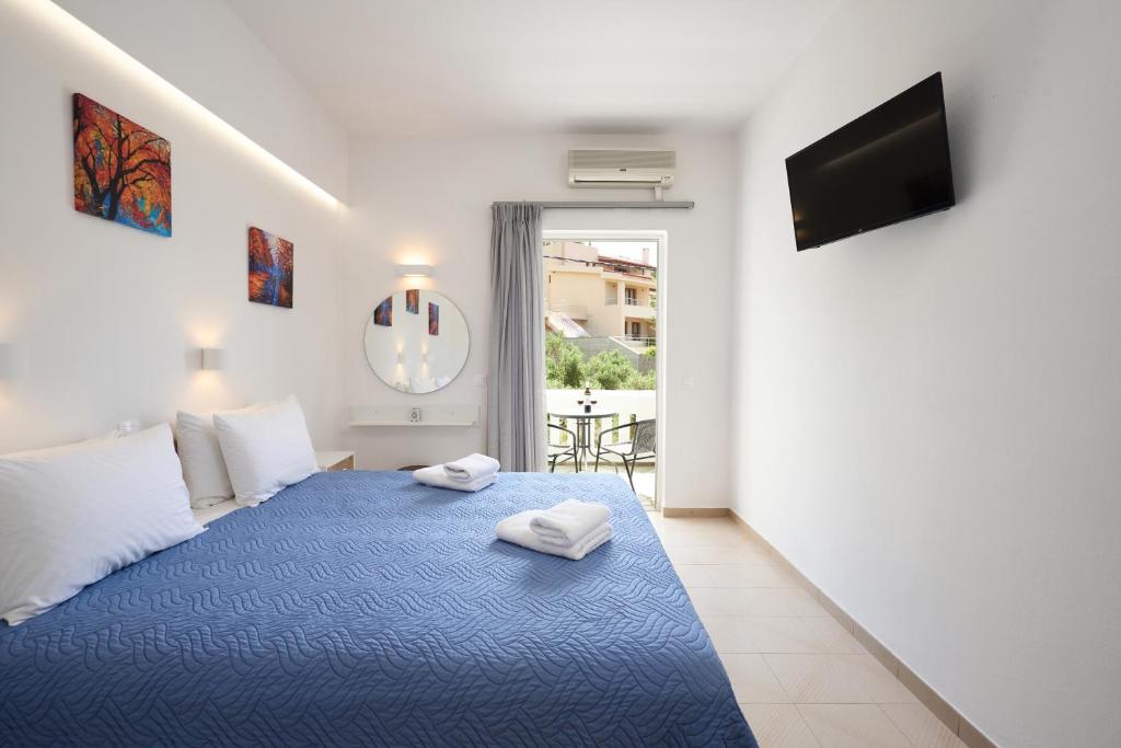 Postel nebo postele na pokoji v ubytování Afroditi Hotel