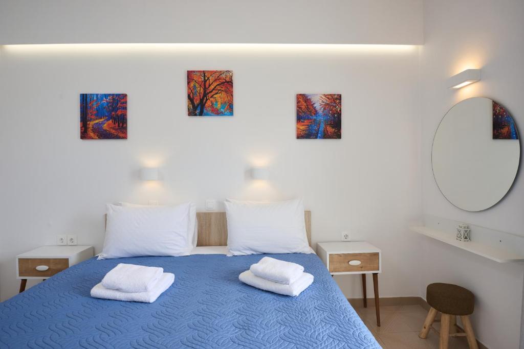 Postel nebo postele na pokoji v ubytování Afroditi Hotel