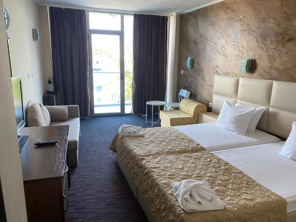 Postel nebo postele na pokoji v ubytování Hotel Kamenec