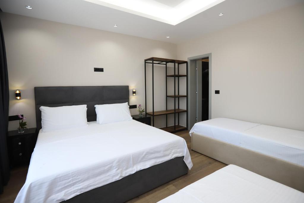 Postel nebo postele na pokoji v ubytování Imperator Hotel